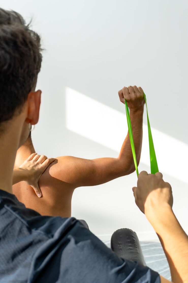 Above: Shoulder toning exercises using tape to raise proprioceptive awareness